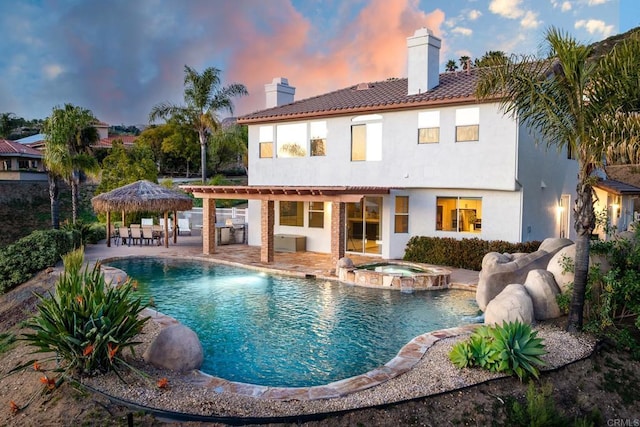 15881 Broad Oaks Rd, El Cajon, CA 92021 - pool at dusk featuring a patio area, a pergola, a pool with connected hot tub, and a gazebo