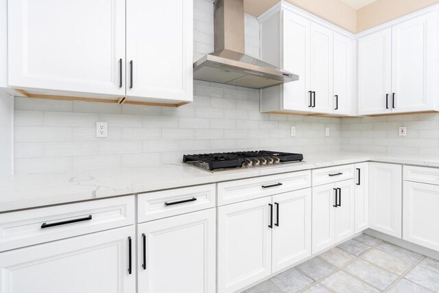 15881 Broad Oaks Rd, El Cajon, CA 92021 - kitchen featuring wall chimney exhaust hood, stainless steel gas stovetop, tasteful backsplash, and white cabinetry