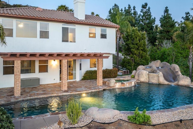 15881 Broad Oaks Rd, El Cajon, CA 92021 - back of property with stucco siding, a pool with connected hot tub, a chimney, a patio area, and a tile roof