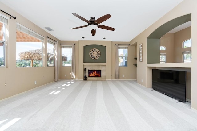 15881 Broad Oaks Rd, El Cajon, CA 92021 - unfurnished living room featuring a warm lit fireplace, carpet floors, ceiling fan, and baseboards