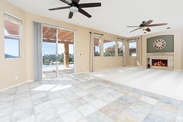 15881 Broad Oaks Rd, El Cajon, CA 92021 - unfurnished living room featuring ceiling fan, healthy amount of natural light, and a lit fireplace