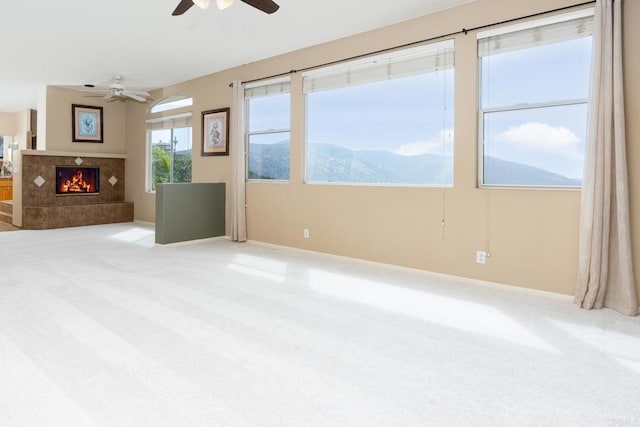 15881 Broad Oaks Rd, El Cajon, CA 92021 - unfurnished living room featuring a high end fireplace, a ceiling fan, carpet floors, and baseboards