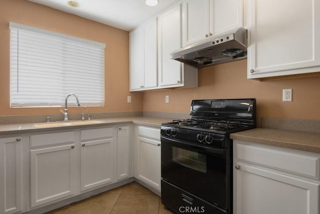 15793 Willow Dr, Fontana, CA 92337 - kitchen with black range with gas cooktop, under cabinet range hood, and white cabinetry