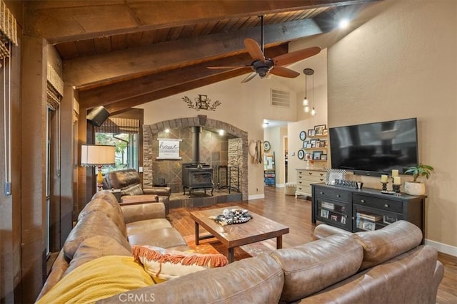 25050 Massachussetts Ave, Corning, CA 96021 - living area featuring a wood stove, wood finished floors, ceiling fan, and wooden ceiling