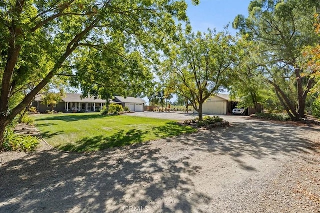 ranch-style home with a front lawn and a garage
