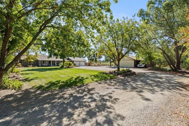 25050 Massachussetts Ave, Corning, CA 96021 - ranch-style home with a front lawn, driveway, and an attached garage