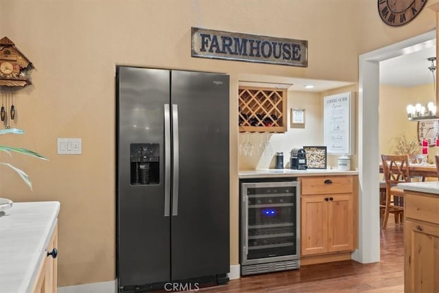 25050 Massachussetts Ave, Corning, CA 96021 - kitchen with stainless steel refrigerator with ice dispenser, wine cooler, dark wood-style floors, light countertops, and a chandelier