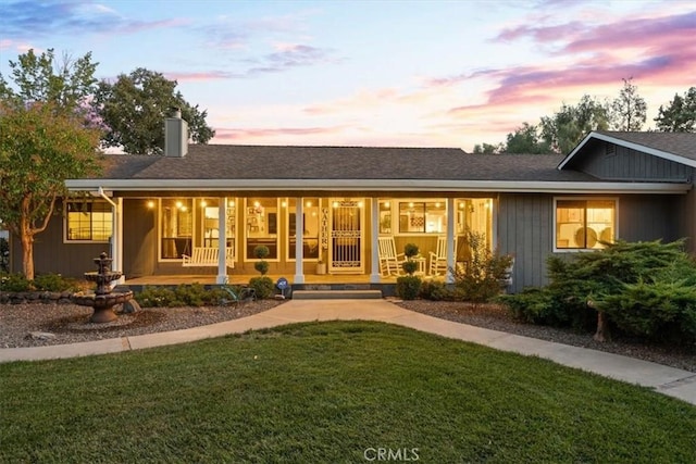 25050 Massachussetts Ave, Corning, CA 96021 - view of front of home featuring covered porch, a chimney, and a front yard