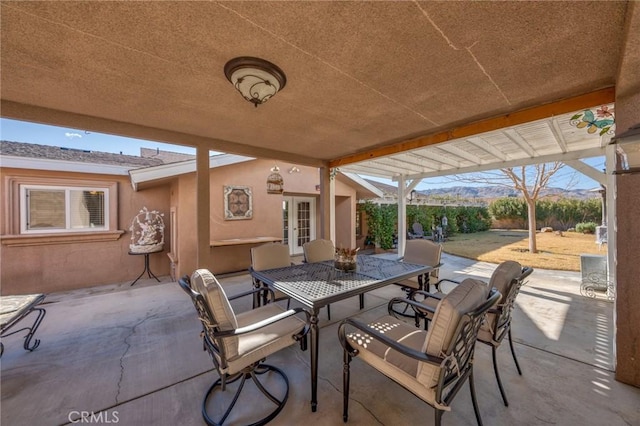 view of patio with french doors and outdoor dining space