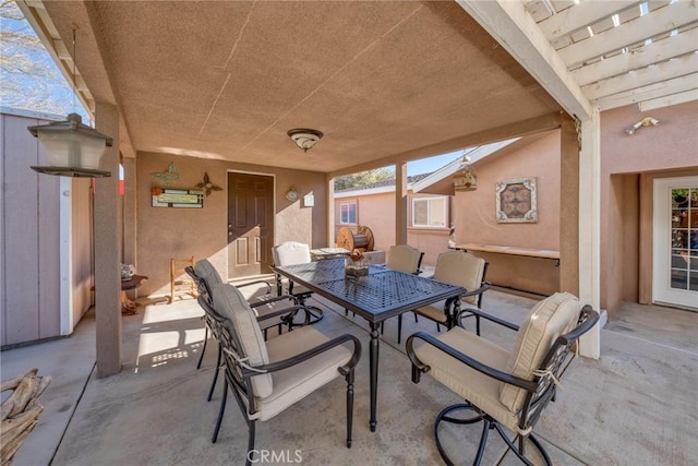 view of patio featuring outdoor dining area