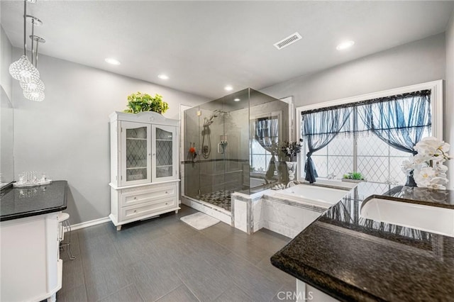 bathroom featuring a shower stall, recessed lighting, a garden tub, and visible vents