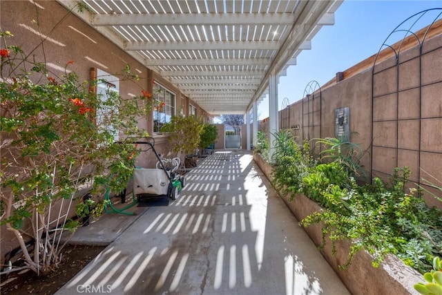 view of patio featuring fence and a pergola