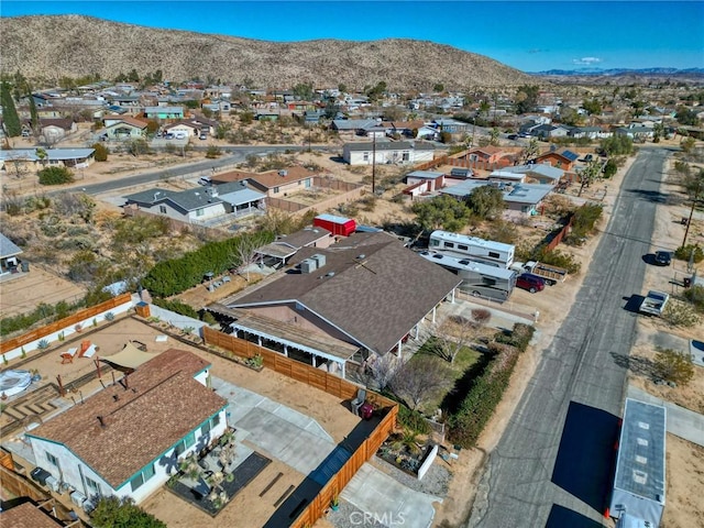drone / aerial view with a residential view and a mountain view