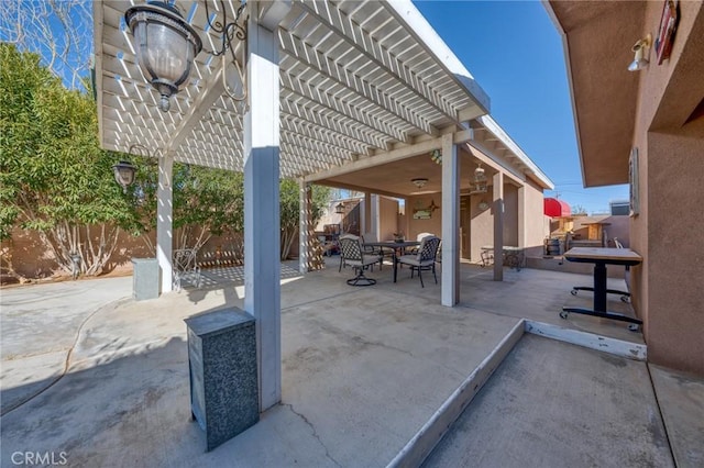 6116 Panorama St, Joshua Tree, CA 92252 - fenced backyard with a pergola, a patio area, and outdoor dining area