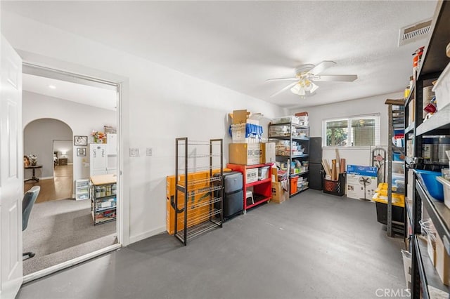 storage room featuring visible vents and ceiling fan