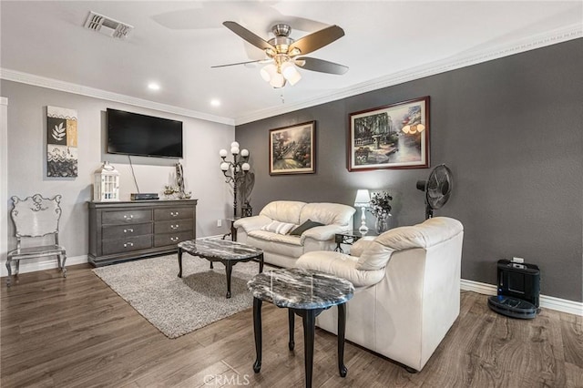 living room featuring baseboards, a ceiling fan, wood finished floors, and visible vents