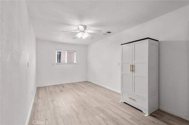 6116 Panorama St, Joshua Tree, CA 92252 - unfurnished bedroom featuring light wood-style floors, baseboards, and a ceiling fan