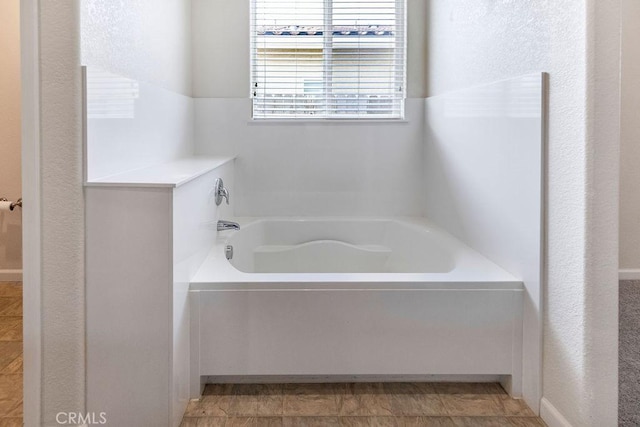 bathroom featuring a garden tub
