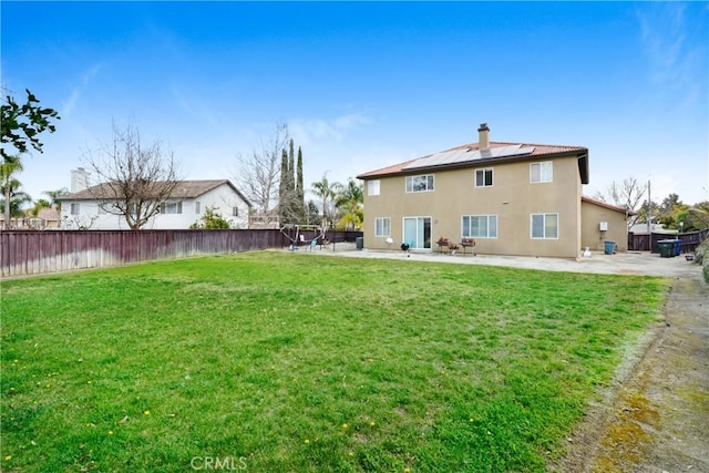 8345 Sunshine Ln, Riverside, CA 92508 - rear view of property with fence, stucco siding, a lawn, a chimney, and a patio area