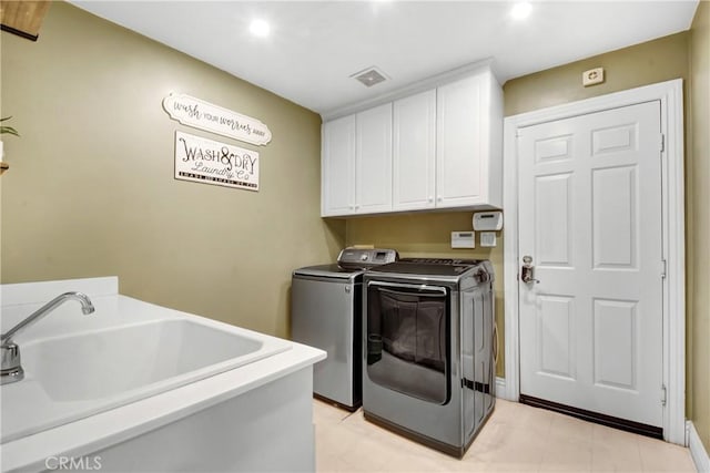 8345 Sunshine Ln, Riverside, CA 92508 - laundry room featuring washer and dryer, cabinet space, visible vents, and a sink