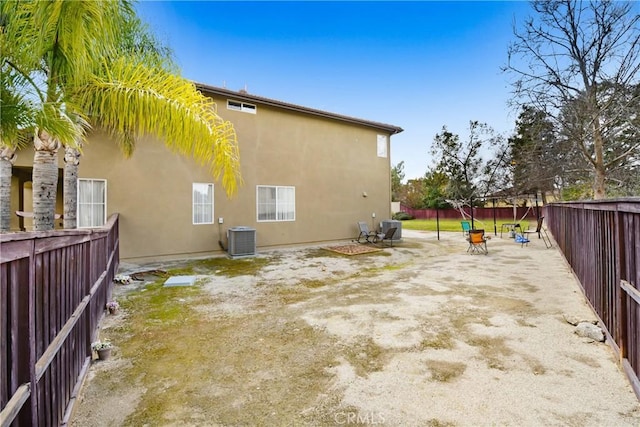 8345 Sunshine Ln, Riverside, CA 92508 - back of house with a patio area, stucco siding, central AC, and a fenced backyard