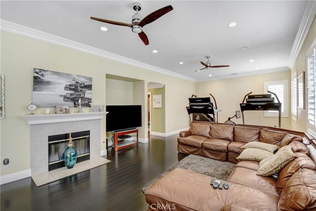 8345 Sunshine Ln, Riverside, CA 92508 - living room with wood finished floors, baseboards, ornamental molding, a tile fireplace, and ceiling fan
