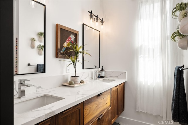 full bath with double vanity and a sink