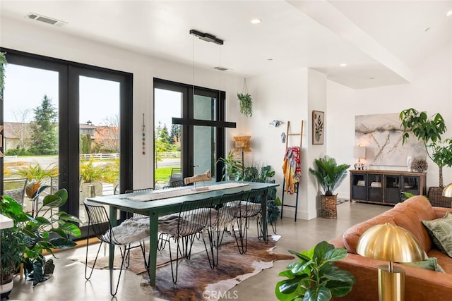 interior space with recessed lighting, french doors, baseboards, finished concrete floors, and visible vents