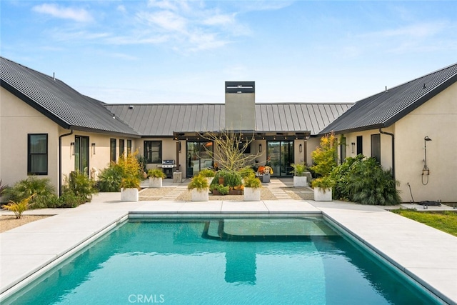 outdoor pool with a patio