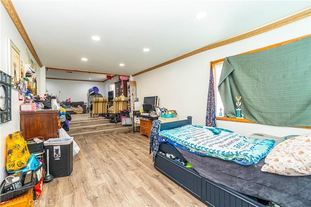 bedroom with recessed lighting, ornamental molding, and wood finished floors