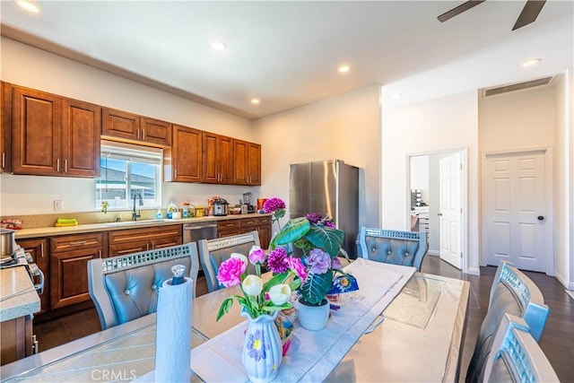 kitchen with light countertops, recessed lighting, a sink, ceiling fan, and visible vents