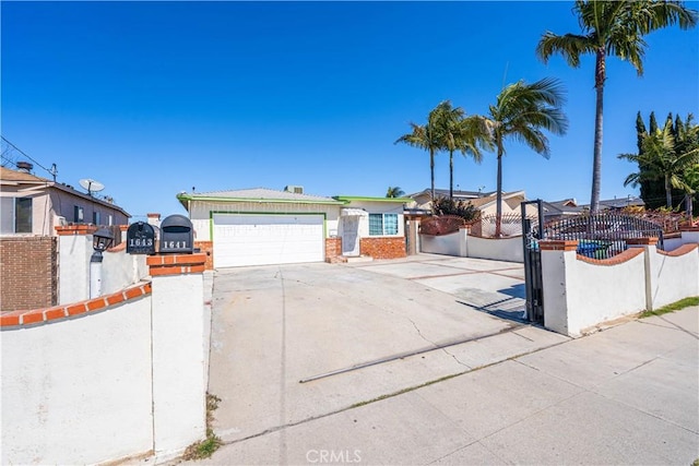 ranch-style home with driveway, a garage, and fence