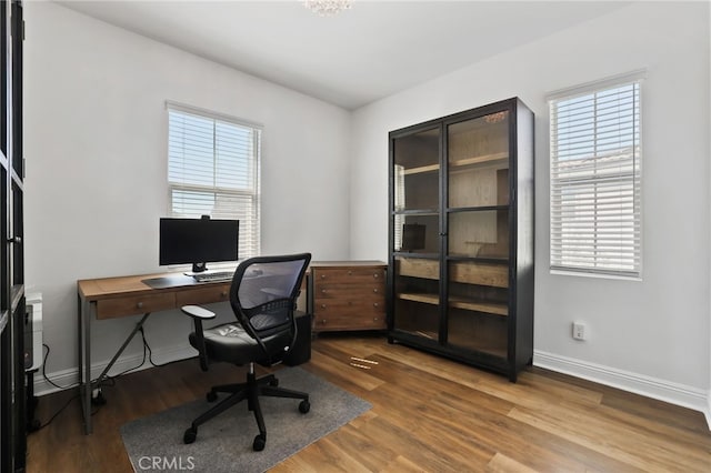 1711 Sonora Creek Ln, Lake Forest, CA 92610 - home office featuring wood finished floors, baseboards, and a healthy amount of sunlight