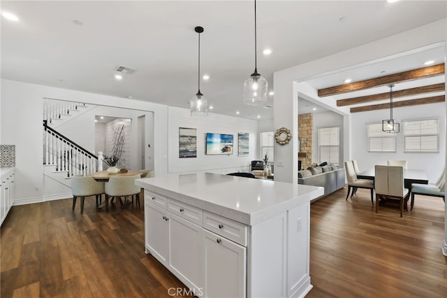 1711 Sonora Creek Ln, Lake Forest, CA 92610 - kitchen featuring dark wood-style flooring, visible vents, open floor plan, and white cabinetry