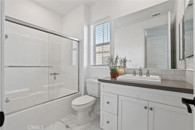 1711 Sonora Creek Ln, Lake Forest, CA 92610 - full bathroom with vanity, enclosed tub / shower combo, toilet, visible vents, and marble finish floor