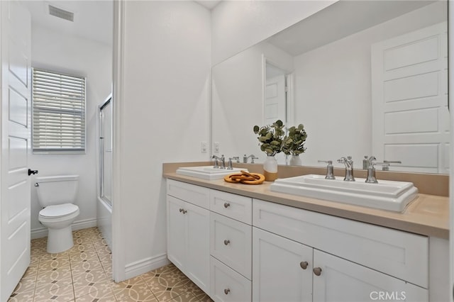 1711 Sonora Creek Ln, Lake Forest, CA 92610 - bathroom with double vanity, visible vents, a sink, and toilet
