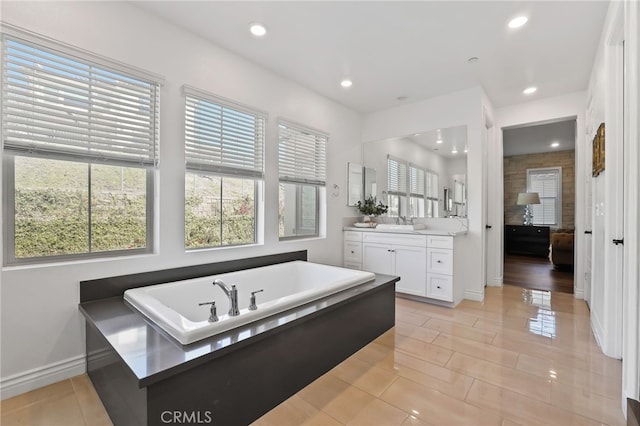 1711 Sonora Creek Ln, Lake Forest, CA 92610 - bathroom featuring vanity, baseboards, tile patterned floors, recessed lighting, and a garden tub