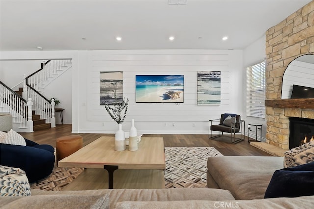 1711 Sonora Creek Ln, Lake Forest, CA 92610 - living area featuring a stone fireplace, recessed lighting, wood finished floors, stairs, and baseboards