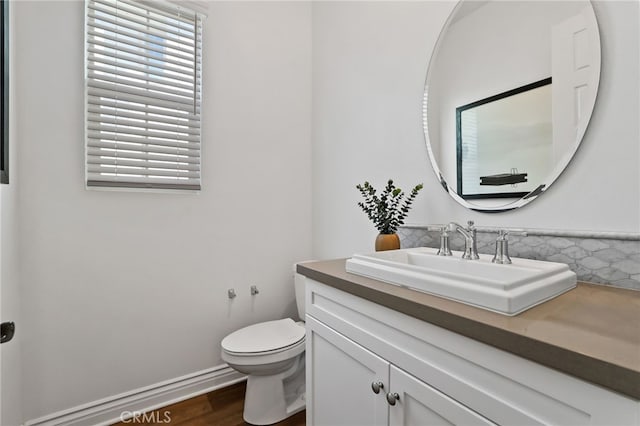 1711 Sonora Creek Ln, Lake Forest, CA 92610 - bathroom with toilet, wood finished floors, vanity, and baseboards