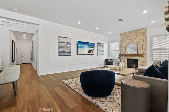 1711 Sonora Creek Ln, Lake Forest, CA 92610 - living area featuring visible vents, baseboards, a stone fireplace, recessed lighting, and wood finished floors