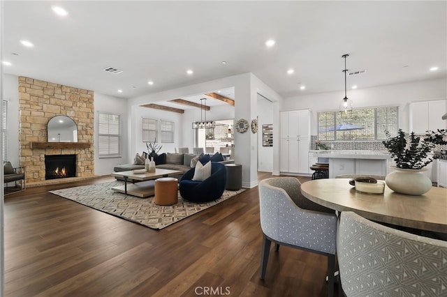 1711 Sonora Creek Ln, Lake Forest, CA 92610 - living area featuring dark wood-type flooring, visible vents, a stone fireplace, and recessed lighting