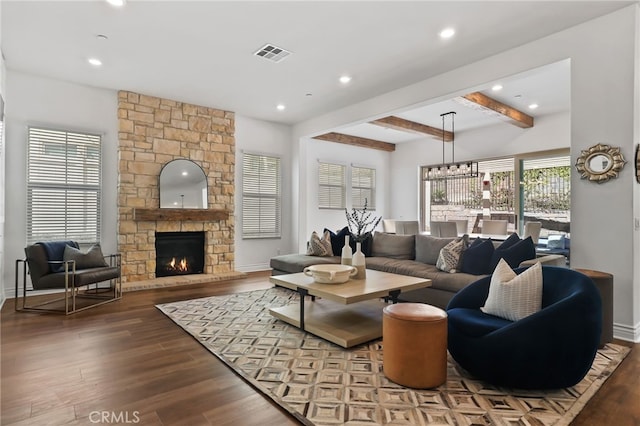 1711 Sonora Creek Ln, Lake Forest, CA 92610 - living room with visible vents, a stone fireplace, beam ceiling, and wood finished floors