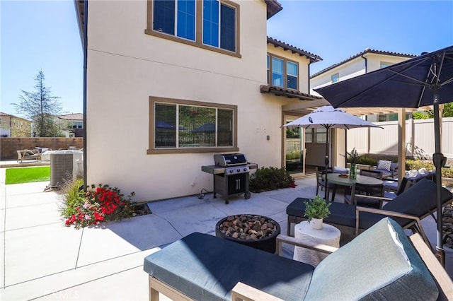 1711 Sonora Creek Ln, Lake Forest, CA 92610 - view of patio / terrace with central AC unit, a grill, an outdoor living space with a fire pit, outdoor dining space, and fence