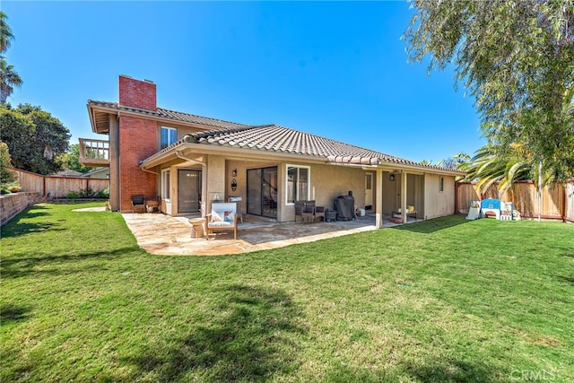 5649 Roane Dr, Oceanside, CA 92057 - rear view of property featuring a chimney, a patio, and a tile roof
