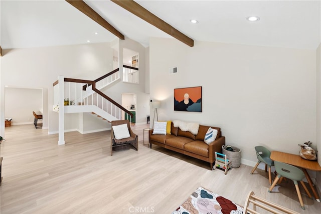 5649 Roane Dr, Oceanside, CA 92057 - living room with stairs, wood finished floors, baseboards, beamed ceiling, and high vaulted ceiling