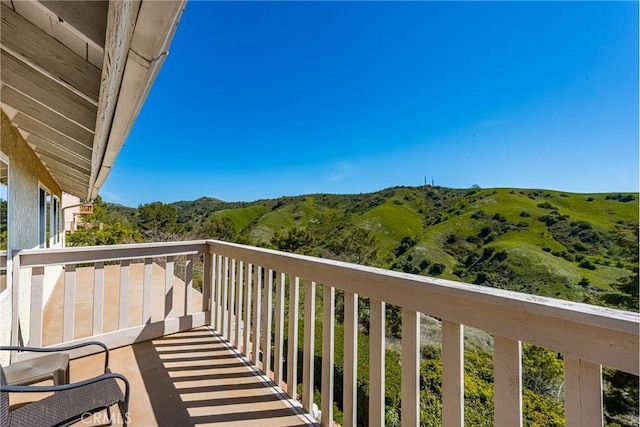balcony featuring a mountain view