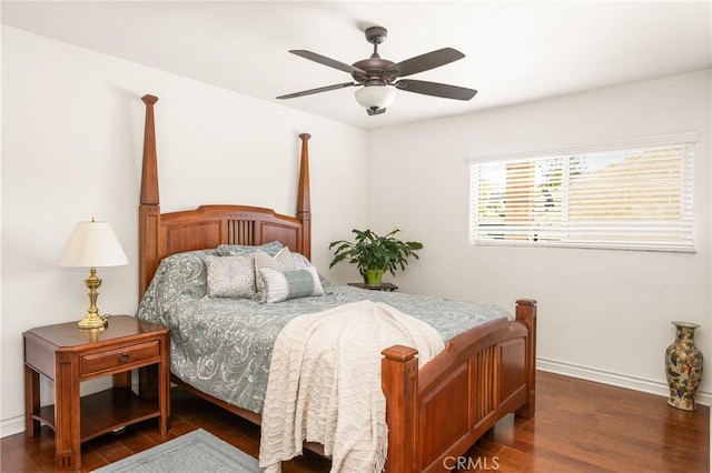 bedroom featuring ceiling fan, baseboards, and dark wood-style flooring