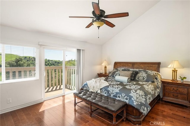 bedroom featuring baseboards, lofted ceiling, wood finished floors, access to outside, and ceiling fan