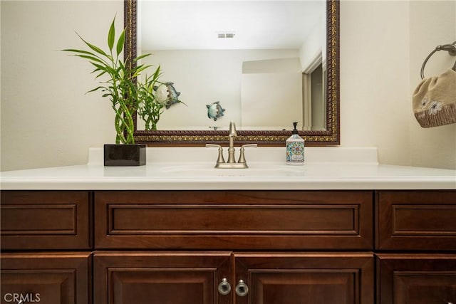 bathroom featuring vanity and visible vents