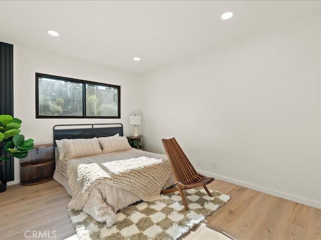 bedroom featuring recessed lighting, baseboards, and wood finished floors
